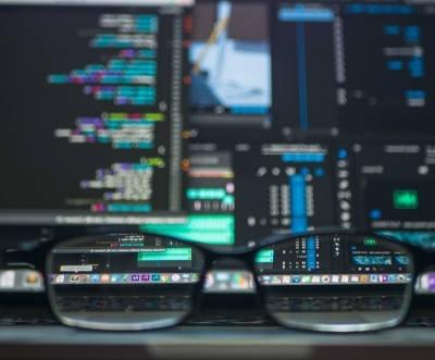 Picture of glasses in front of a computer screen.